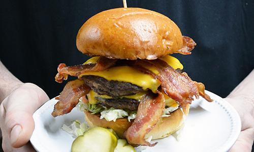 Chef holding burger